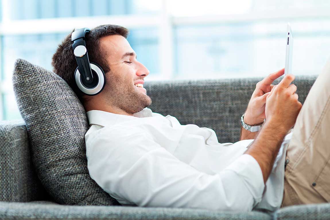bigstock-Man-on-sofa-with-headphones-an-46762474.jpg